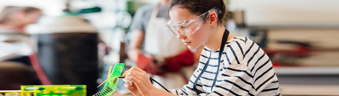 A female student works in an engineering lab