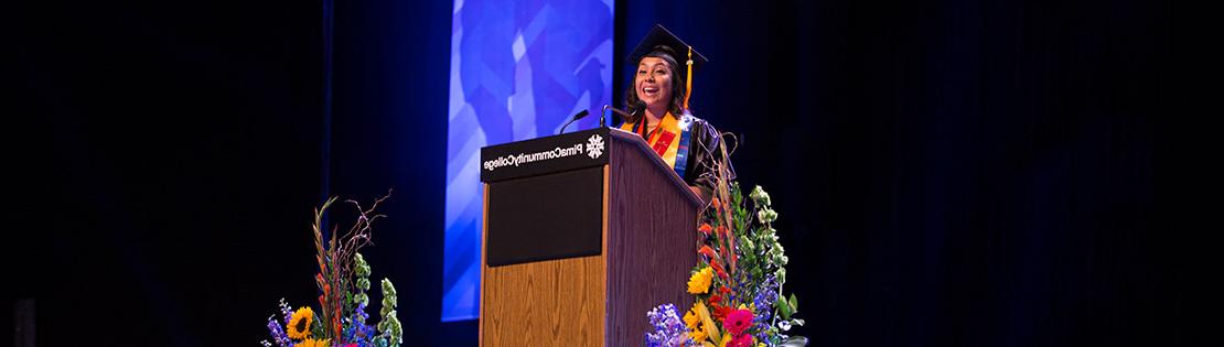 Francy Luna Diaz stands at the podium to give her speech