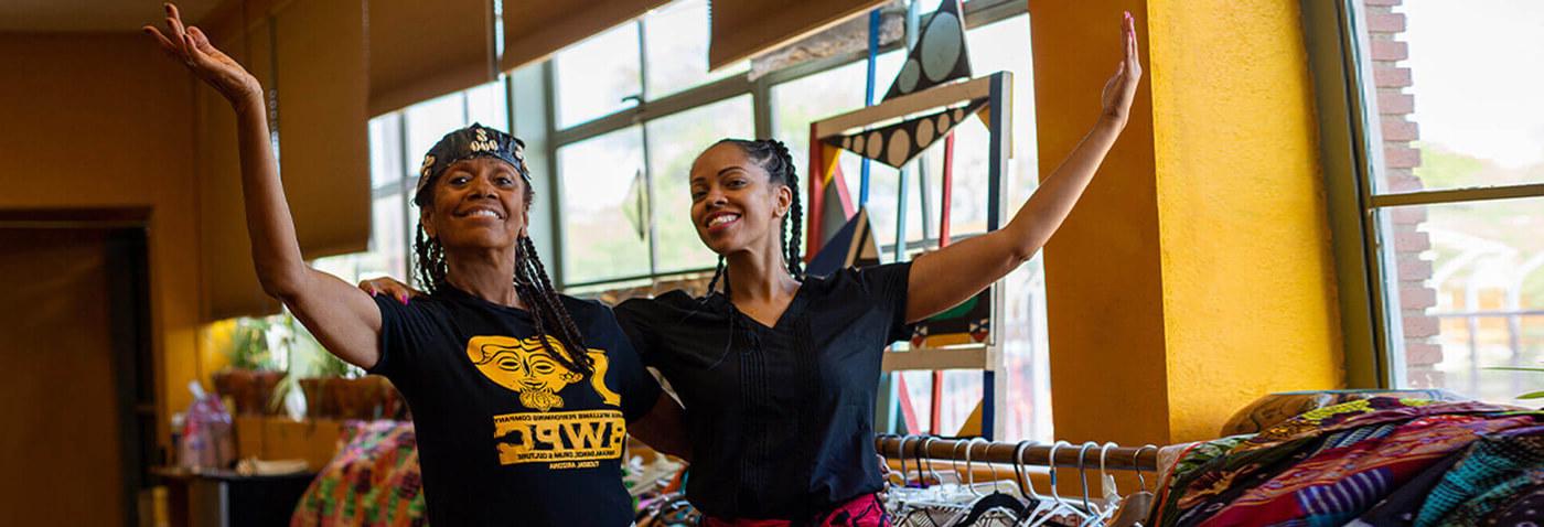 Barbea Williams and her daughter Bea pose for a photo in their dance studio