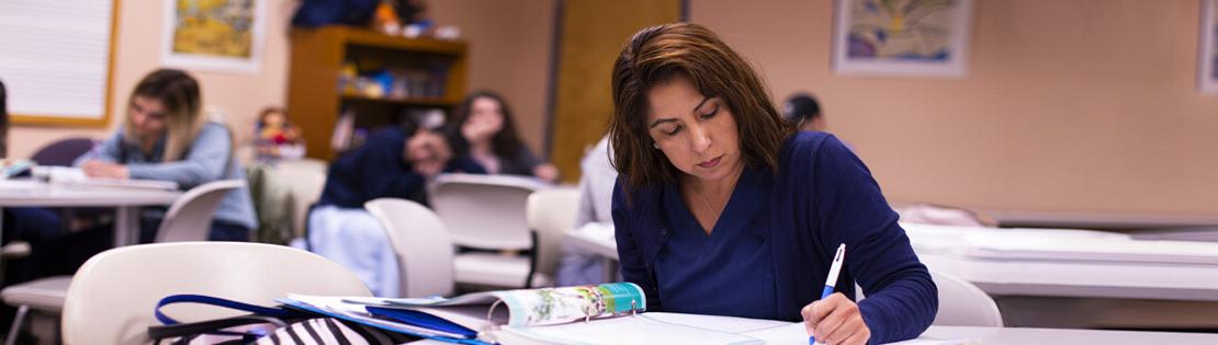 An adult learner studies at a Pima Adult Learning Center